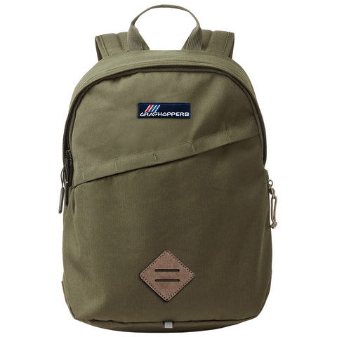 A green backpack features a front zippered pocket and a logo patch at the top. It has two shoulder straps and a top handle for carrying. The material appears durable.