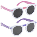 Eyelevel Junior Talia Sunglasses Two pairs of round sunglasses are displayed. One pair has pink accents while the other has purple. Both have dark lenses and white frames, suggesting a playful, colorful style.