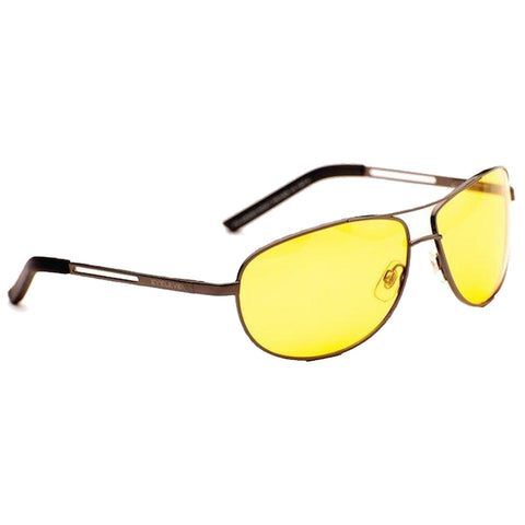 A pair of sunglasses with yellow lenses rests against a white background highlighting their sleek design and metallic frame suggesting they are intended for outdoor use or driving.