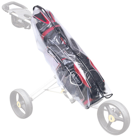 A golf bag is covered by a transparent rain cover while resting on a golf push cart in an outdoor setting. The cover protects the bag and clubs from rain.