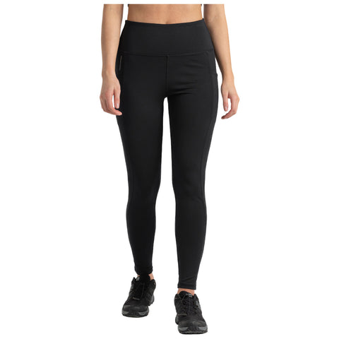 Black leggings are being worn by a person standing upright in a neutral position their hands relaxed at their sides with black athletic shoes visible on their feet