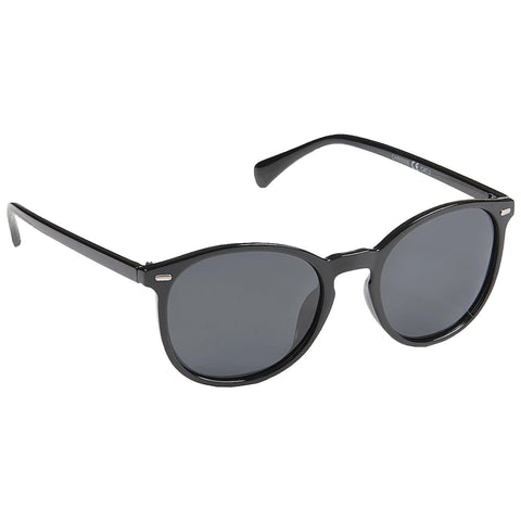 Black sunglasses with round frames rest on a flat surface reflecting light indicating their purpose of blocking sunlight while adding a stylish accessory to a summer outfit.